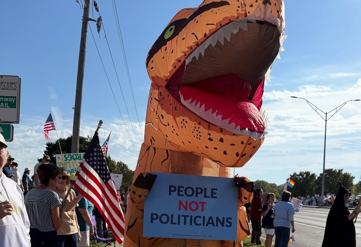 Photo: People Not Politicians Missouri signature gatherer in an inflatable dinosaur costume
