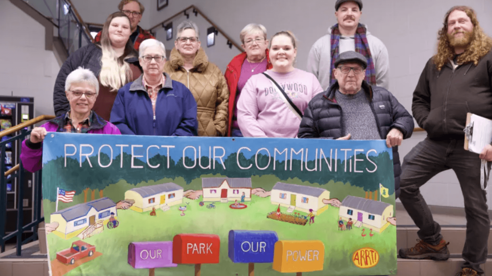 Photo: Mobile home residents in August, ME rally for rent stablilization with Maine Labor Climate Council.